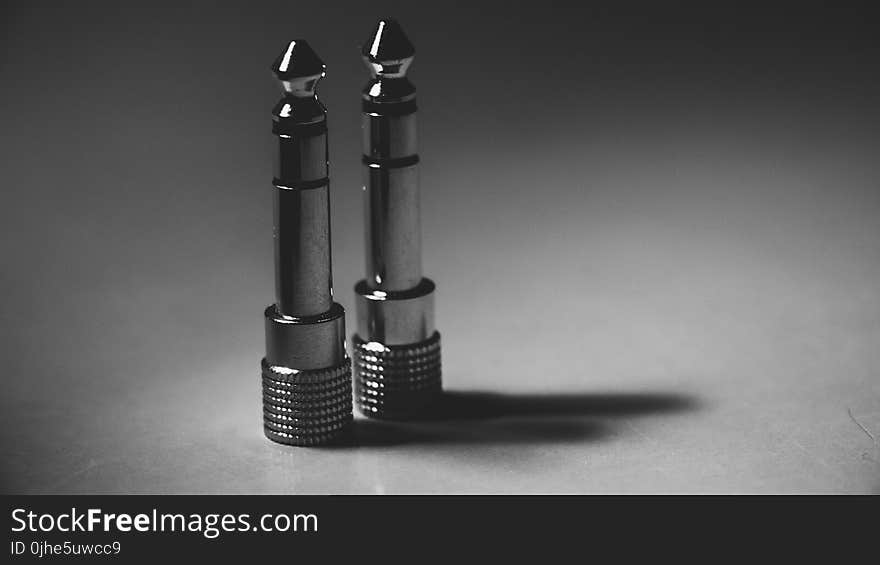 Two Gray Cordless Audio Jacks