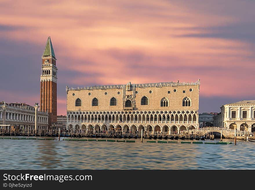 Brown Building With Body of Water