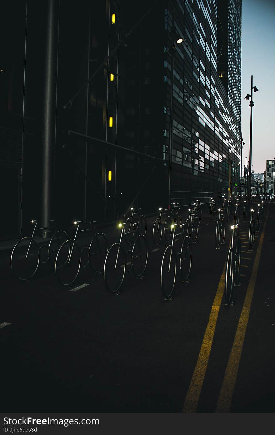 Gray Bike on Road Between Buildings