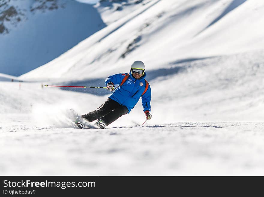 Man Snow Skiing on Bed of Snow during Winter