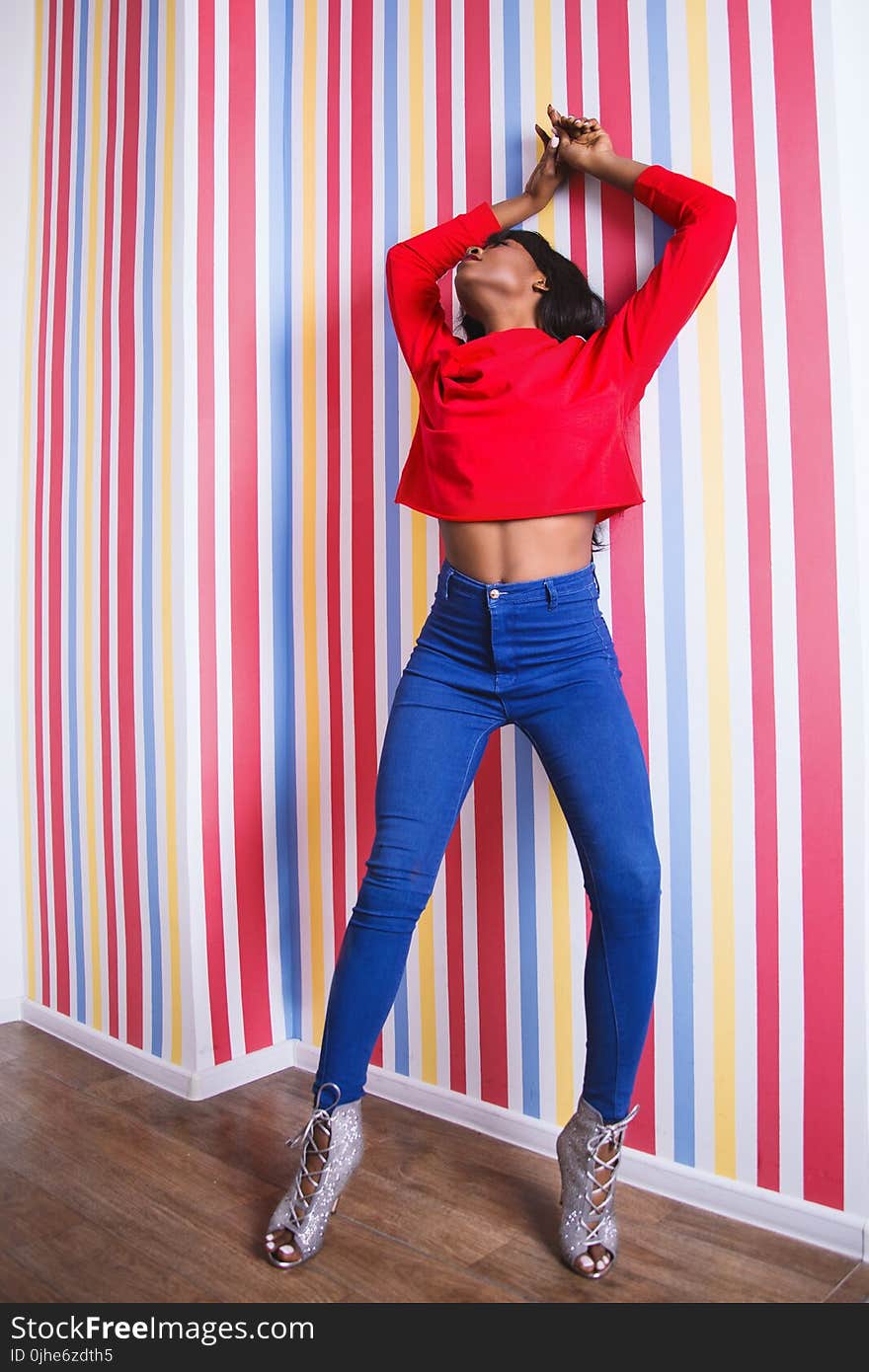 Woman Wearing Long-sleeve Crop-top and Blue Pants