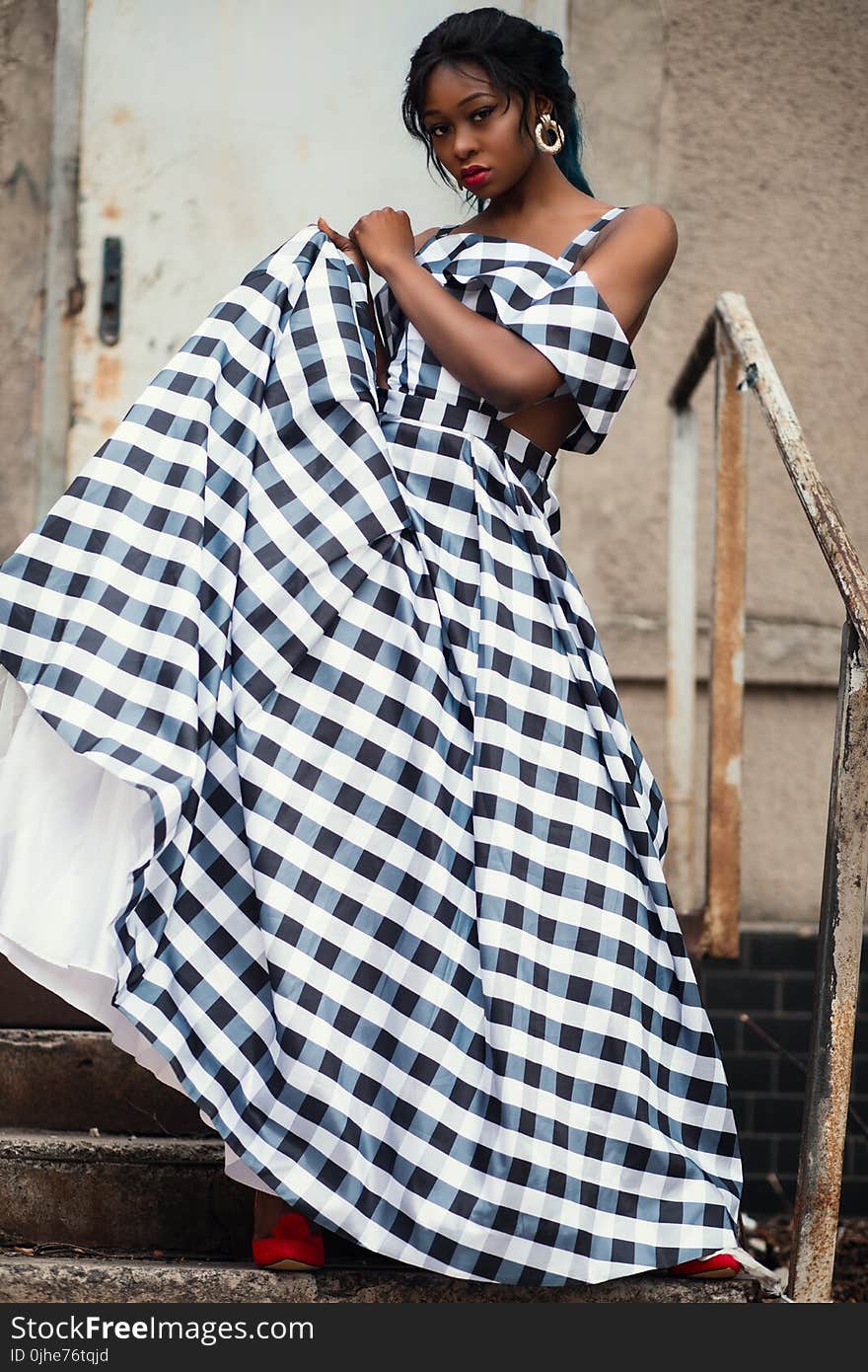 Photo of a Woman Wearing Gingham Dress