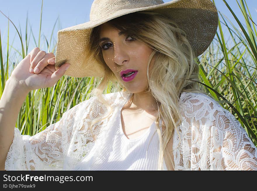 Blonde Hair Woman Wearing Brown Hat