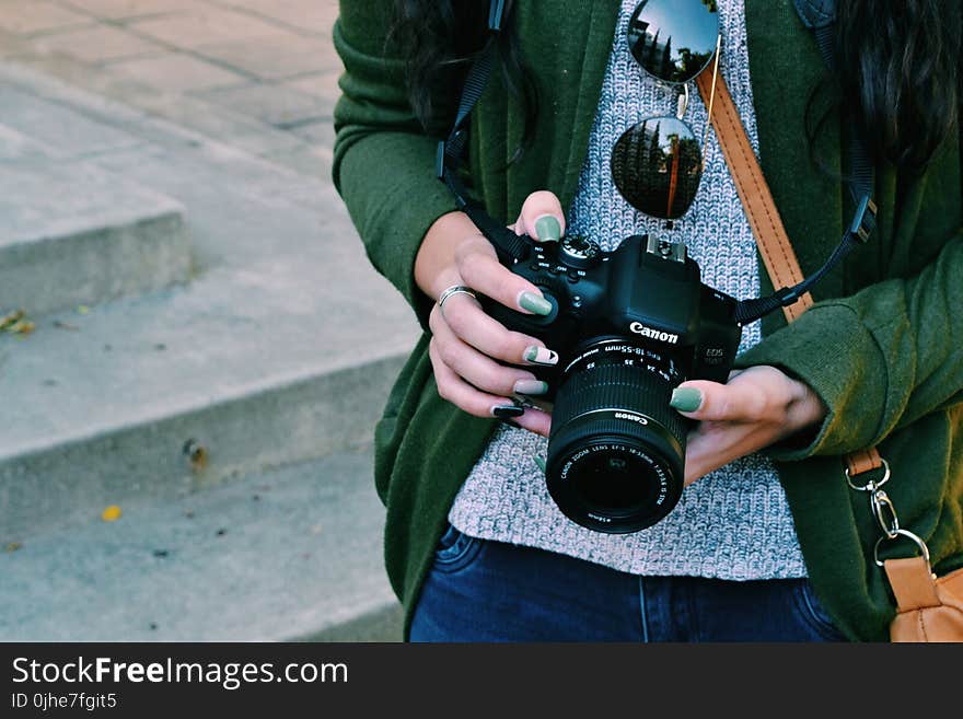 Woman Holding Black Canon Dslr Camera