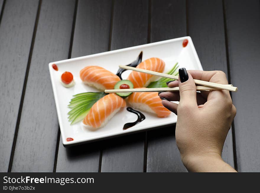 Person Eating Sushi