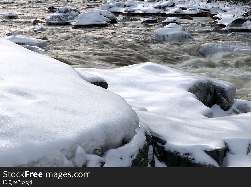 Closeup Photo Black Stone With Snows