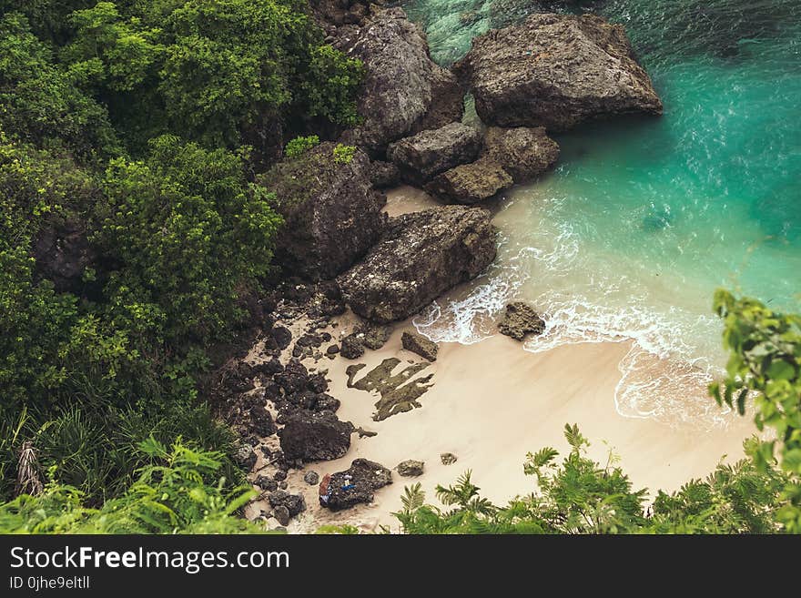 Aerial View of Seashore Near Large Grey Rocks