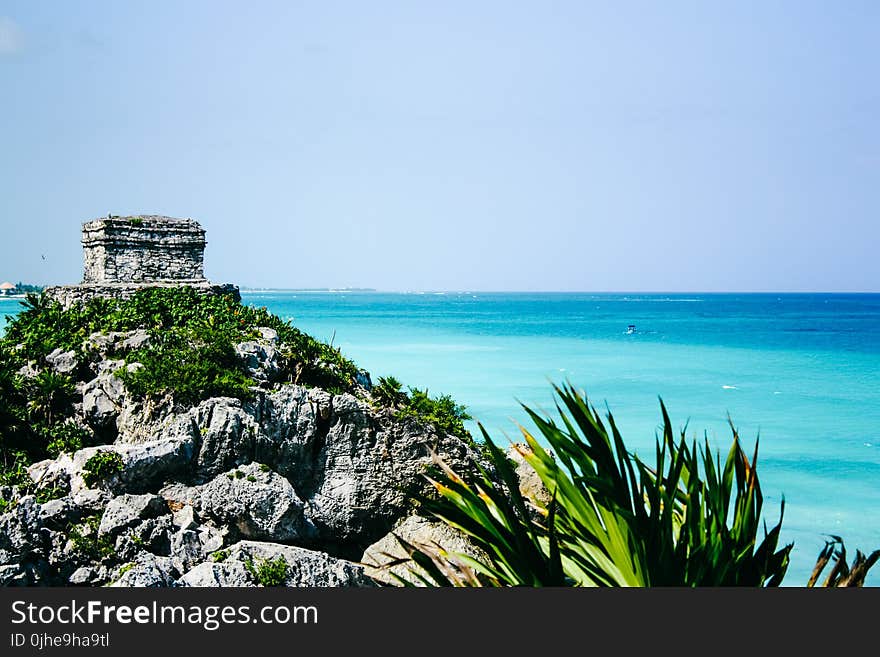 Photography of Ocean and Rock Formation