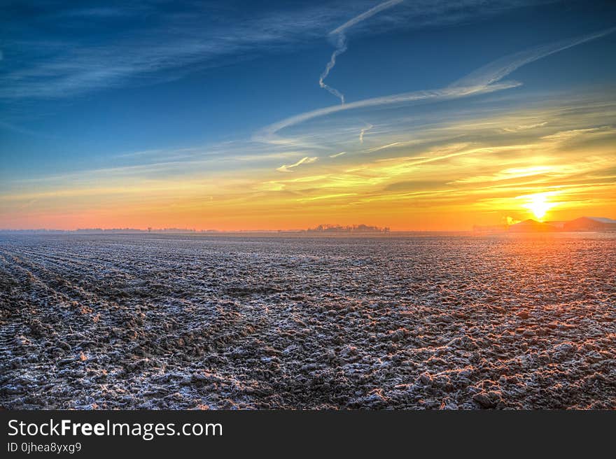 Brown Field during Sunset