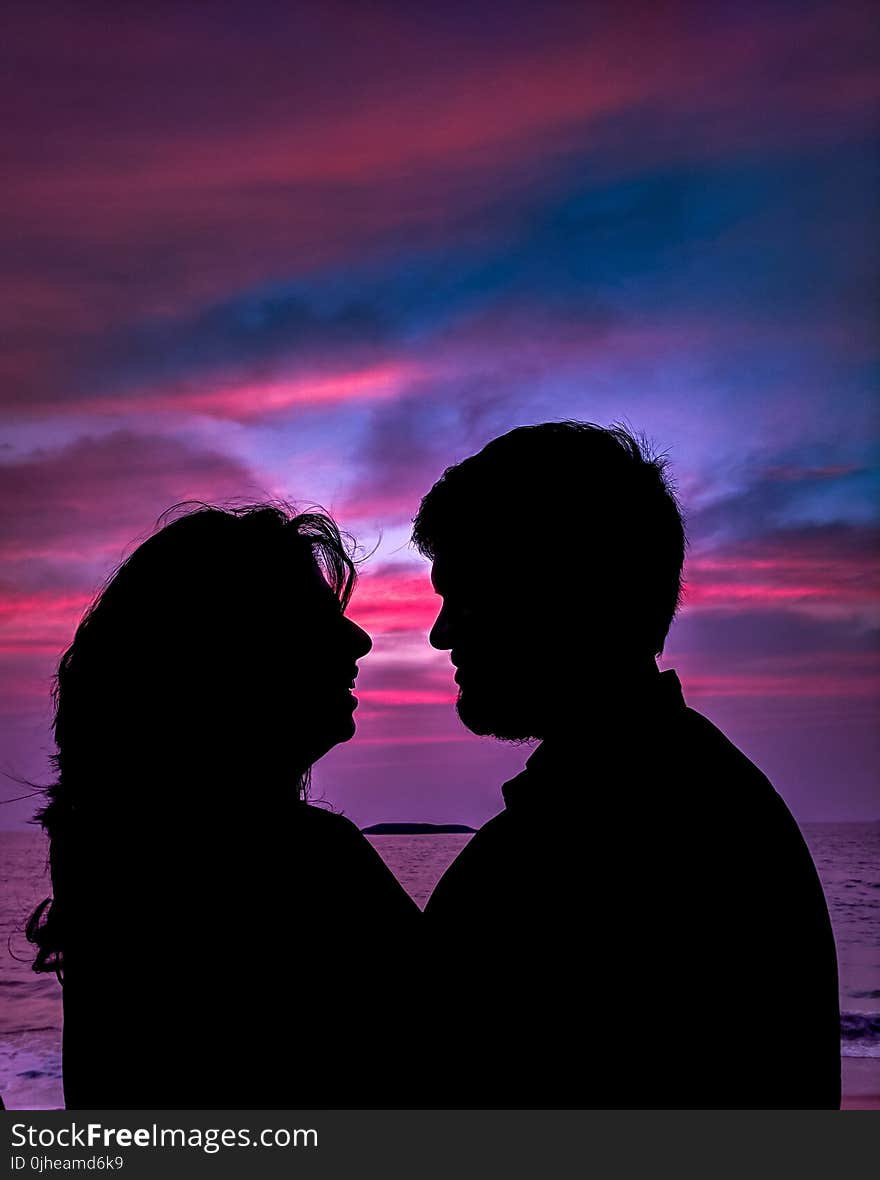 Silhouette of Couple Facing Each Other