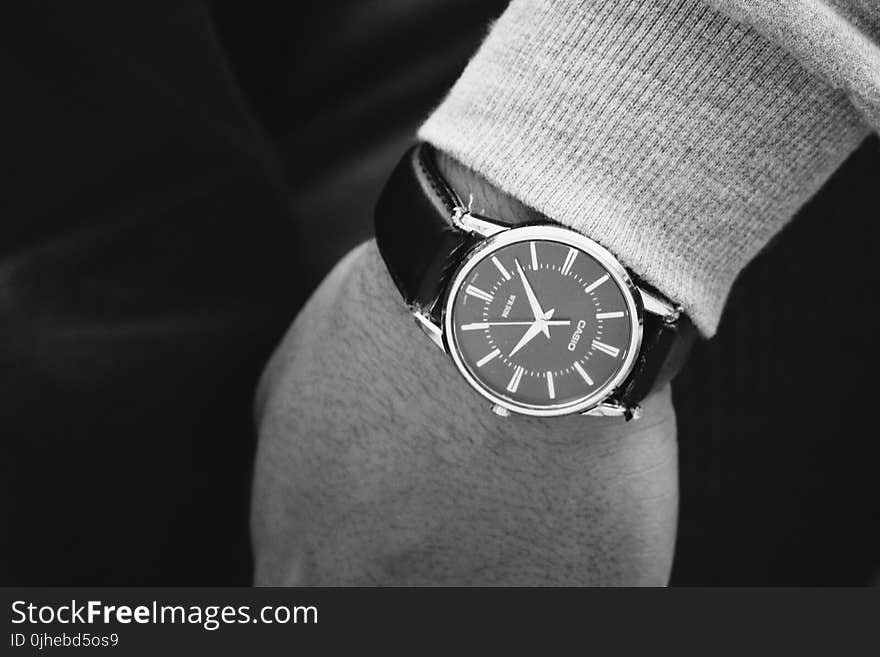 Person Wearing Round Silver Analog Watch With Black Leather Strap