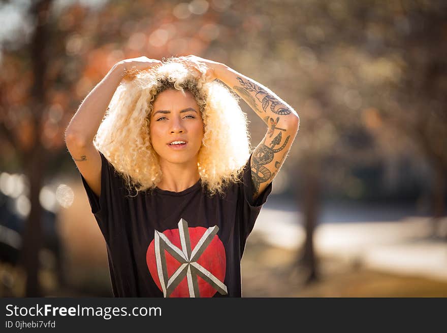 Woman Wearing Black Crew-neck T-shirt