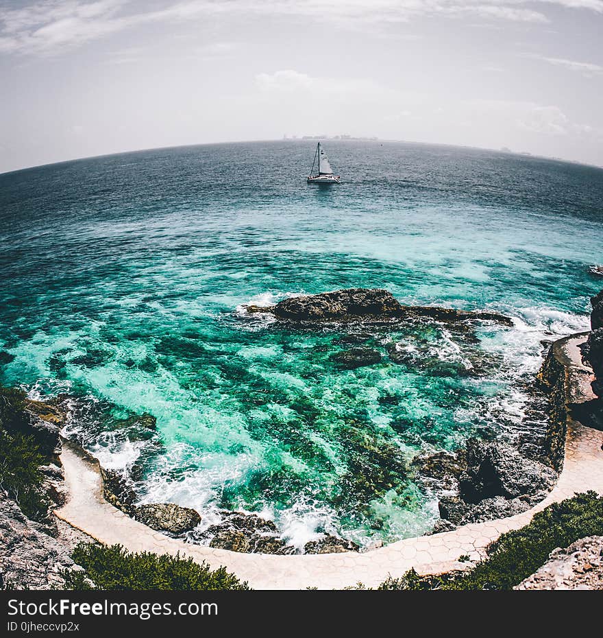 White Sailboat on Sea Water Fish-eye Photo