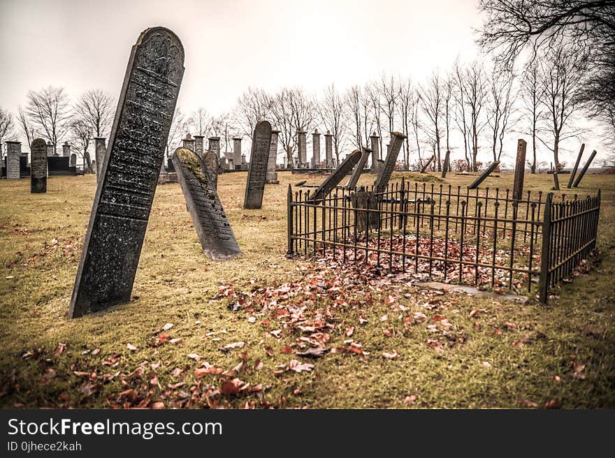 Photography of Graveyard Under Cloudy Sky