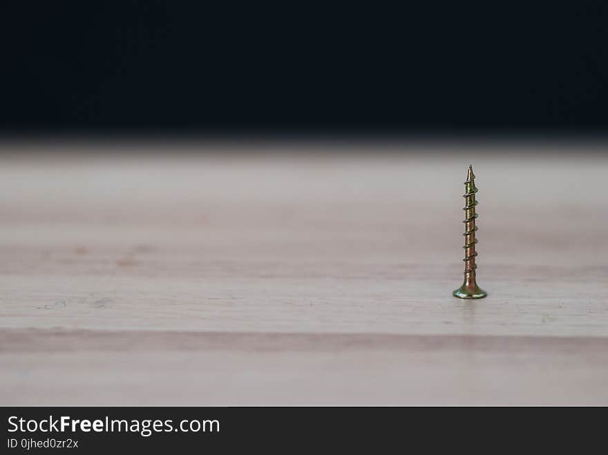 Close-up Photography of a Brass Colored on Top of the Table