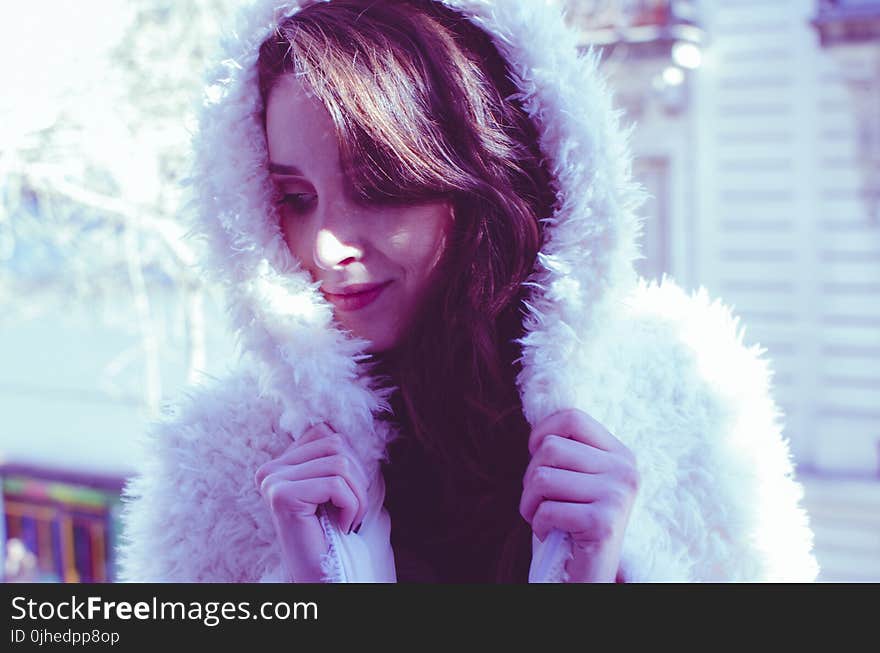 Photography of a Woman in White Fur Coat