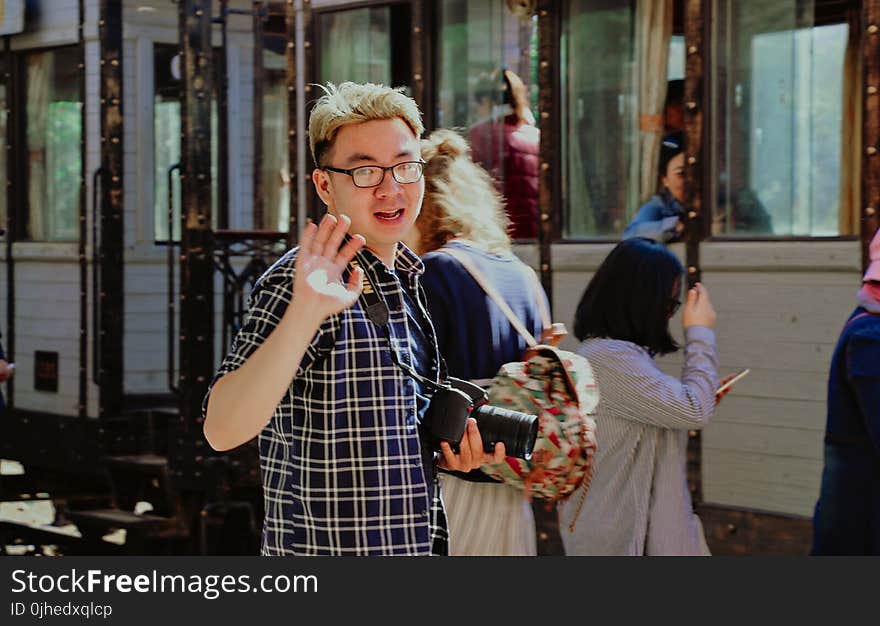 Man With Bridge Camera Waving