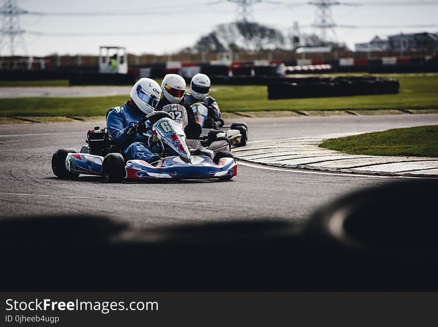 Three Men Riding on Go Karts