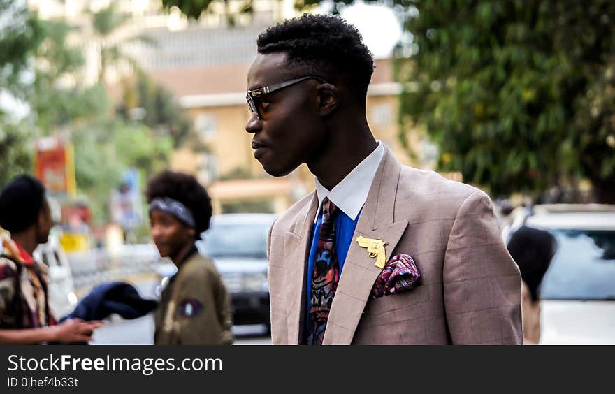 Man Wearing Brown Formal Coat