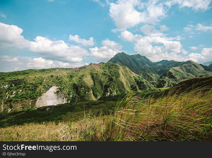 Photo of Mountains Covered with Grass