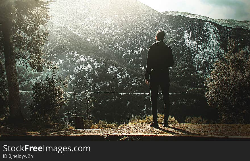 Man Standing On Cliff