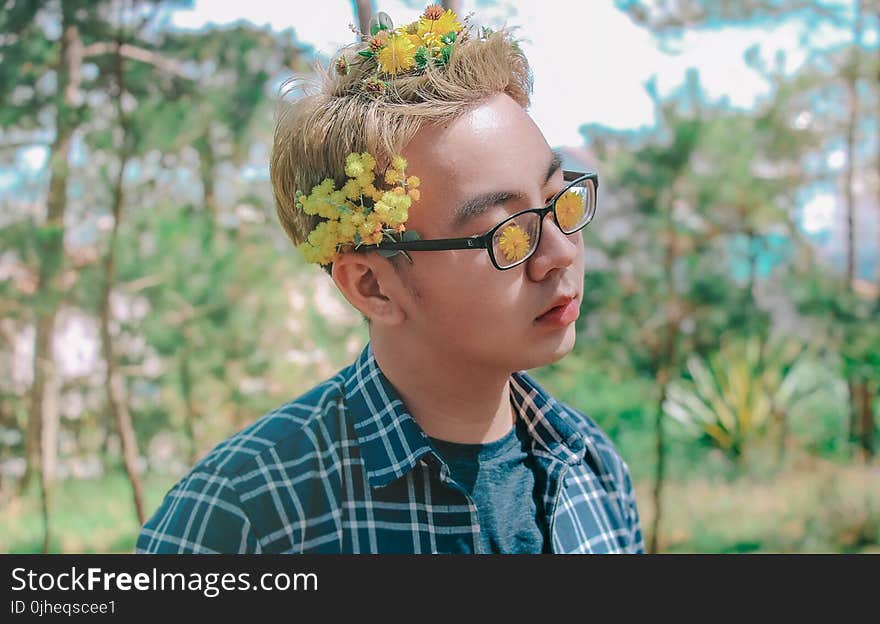 Photo of a Man with Flowers on His Hair