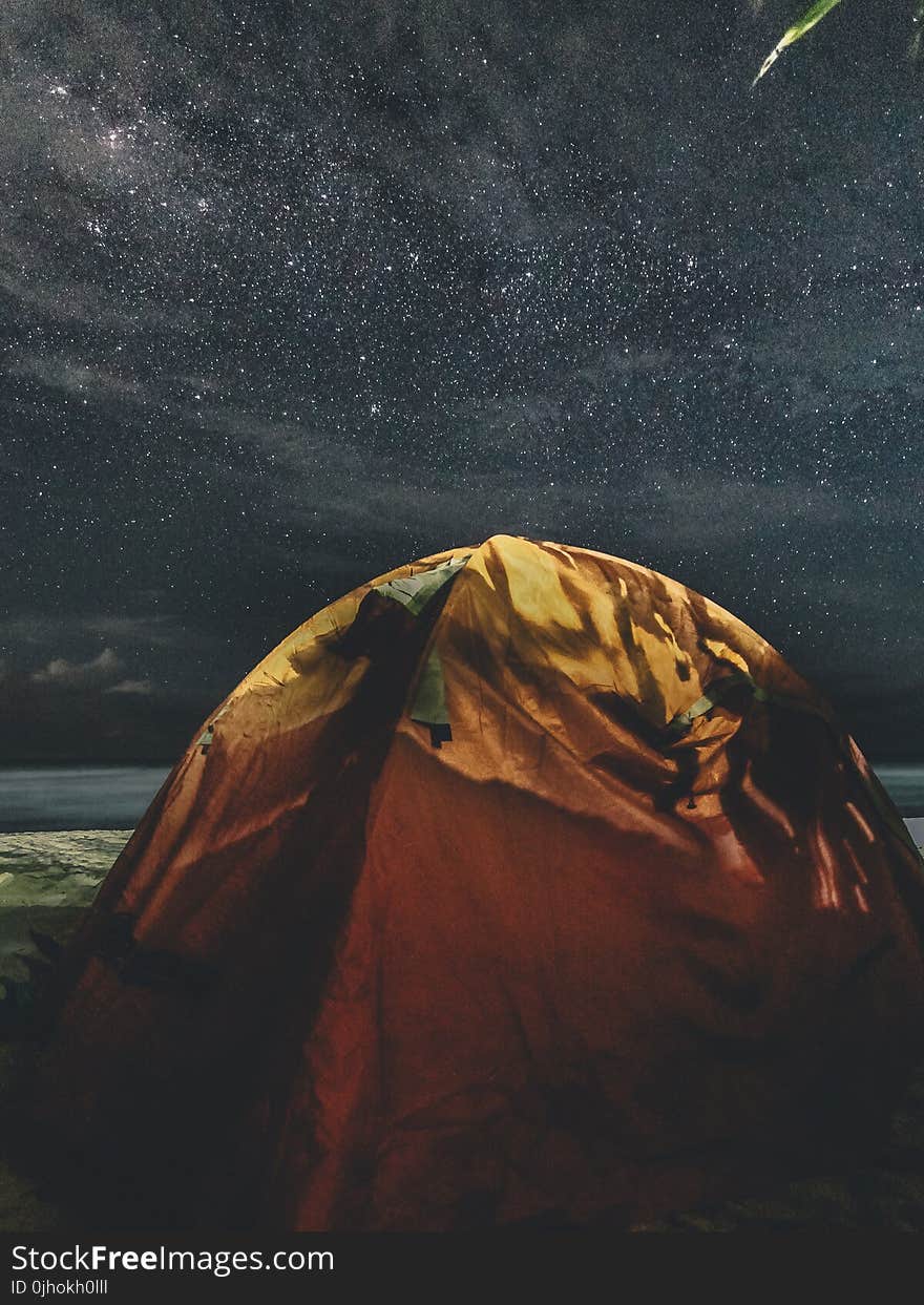 Orange and Green Camping Tent Under Starry Sky