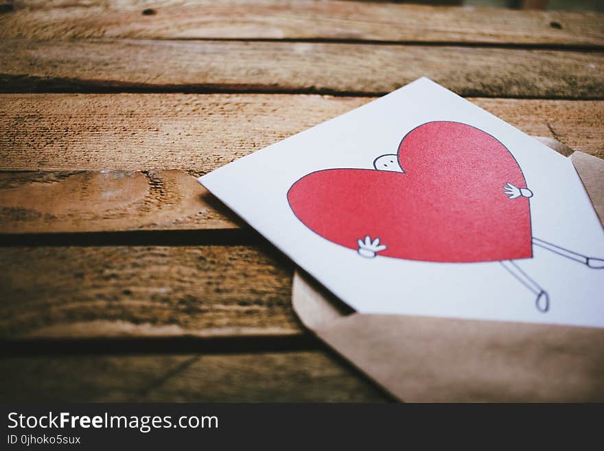 Man Holding Red Heart Poster