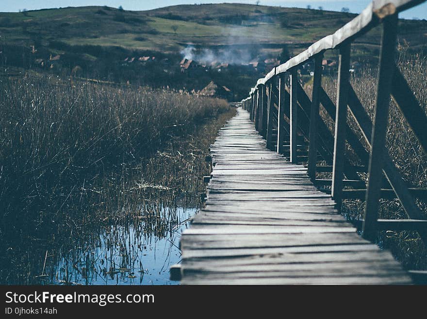 Landscape Photograph of Wooden Bridge Going Up the Mountain