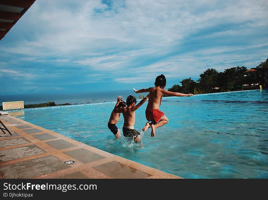 Three Boy&#x27;s Jumping Into the Water