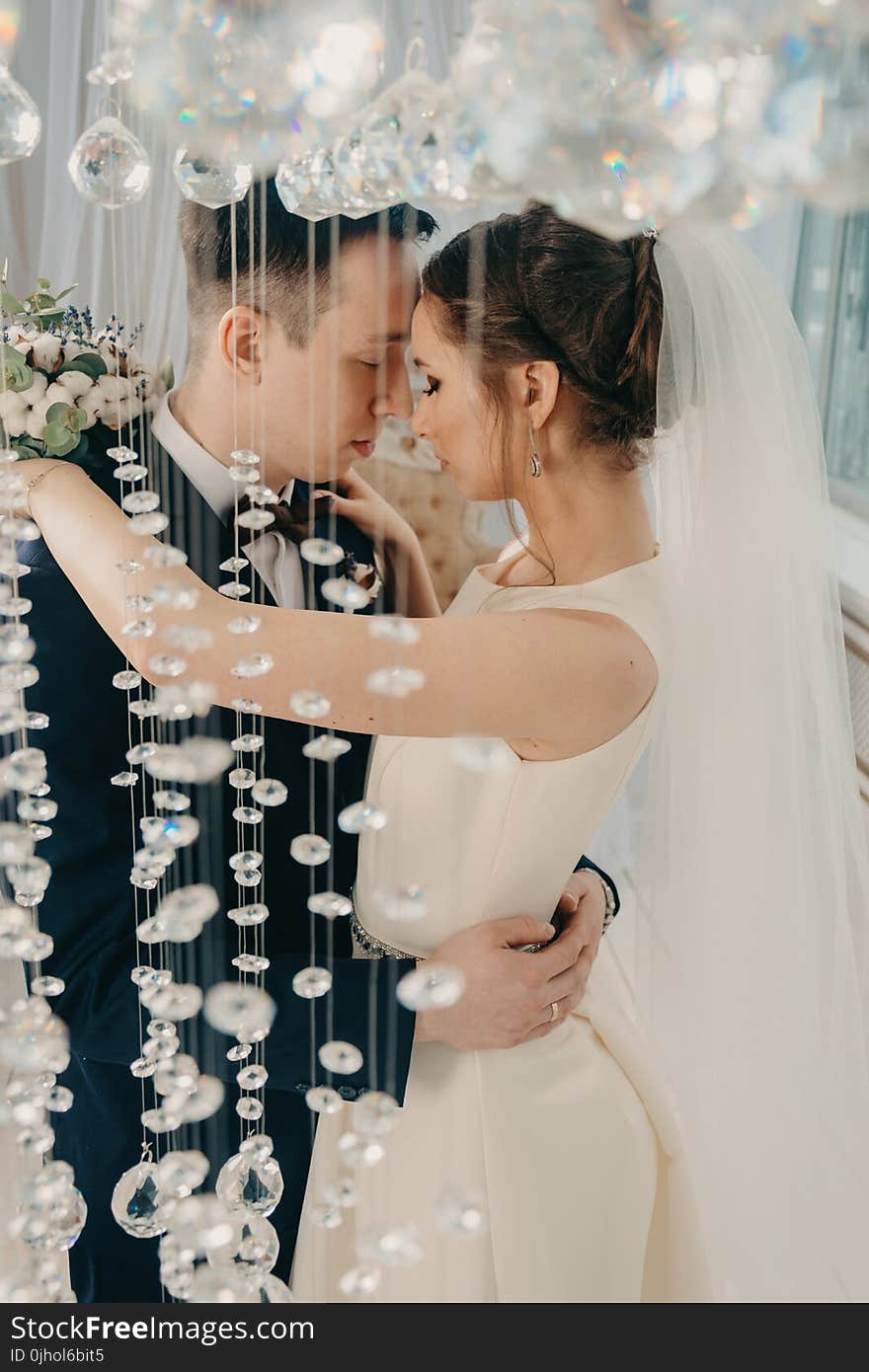 Woman Hugging Man on Wedding