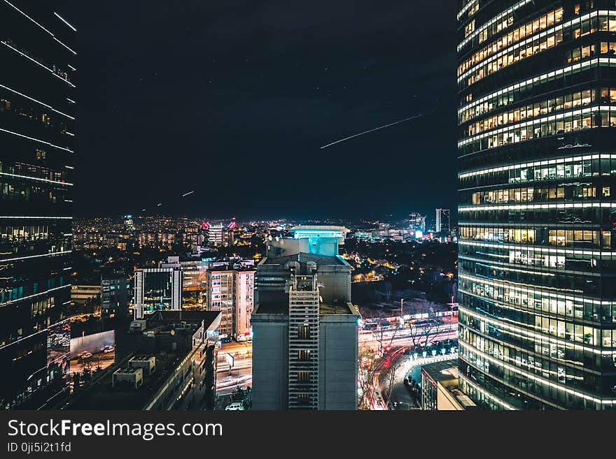 High Rise City Building during Night Time Photo