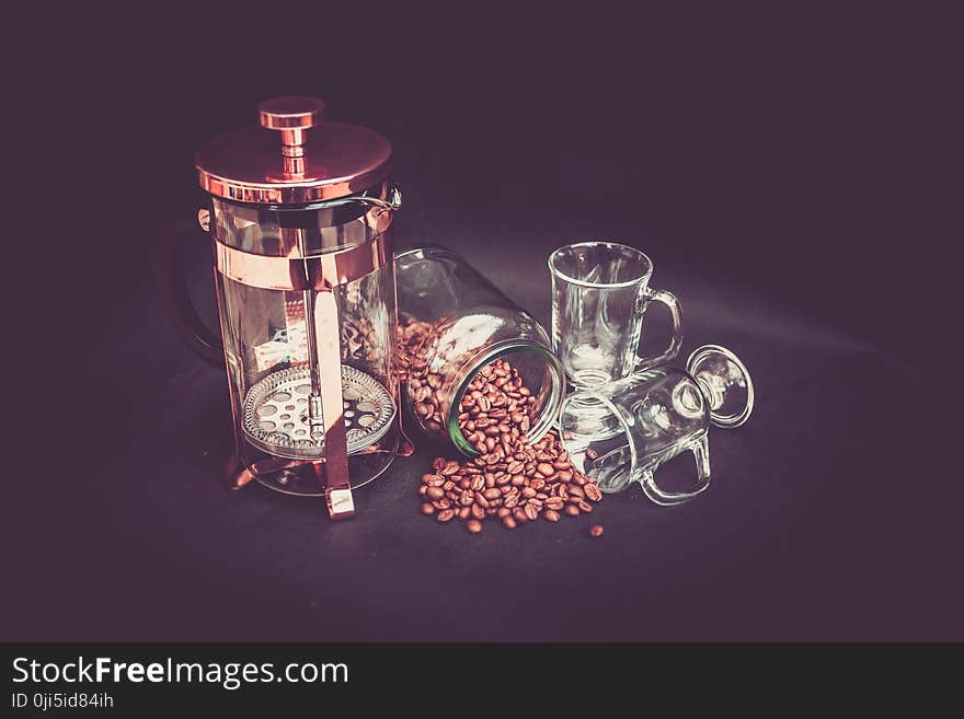 Photograhy of Brown Beans, Clear Glass Mug, and Brass Coffee Grinder