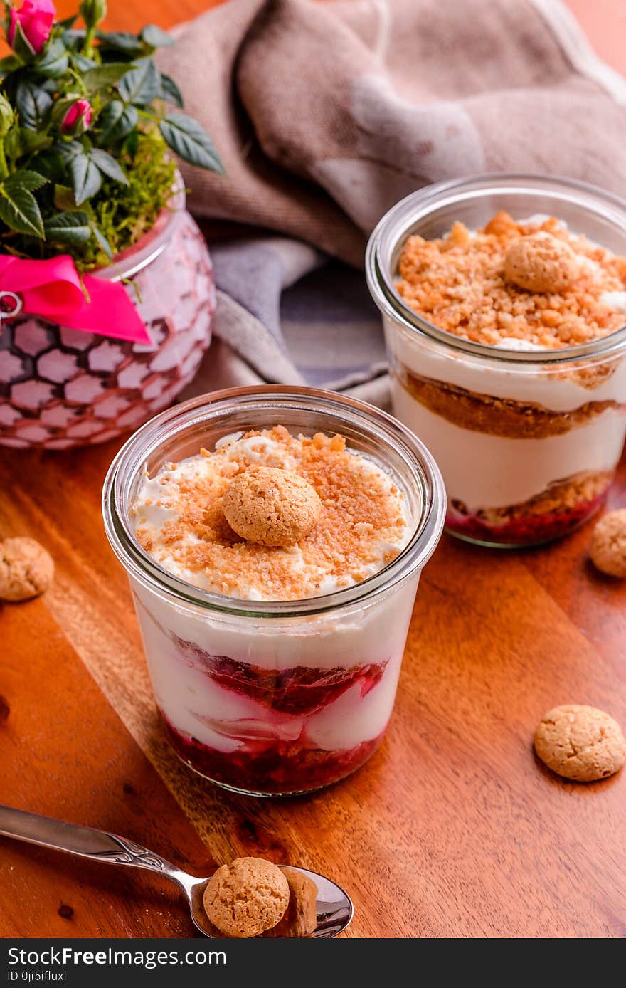 Two Strawberry Soft Served Filled Cups With Cookie Toppings