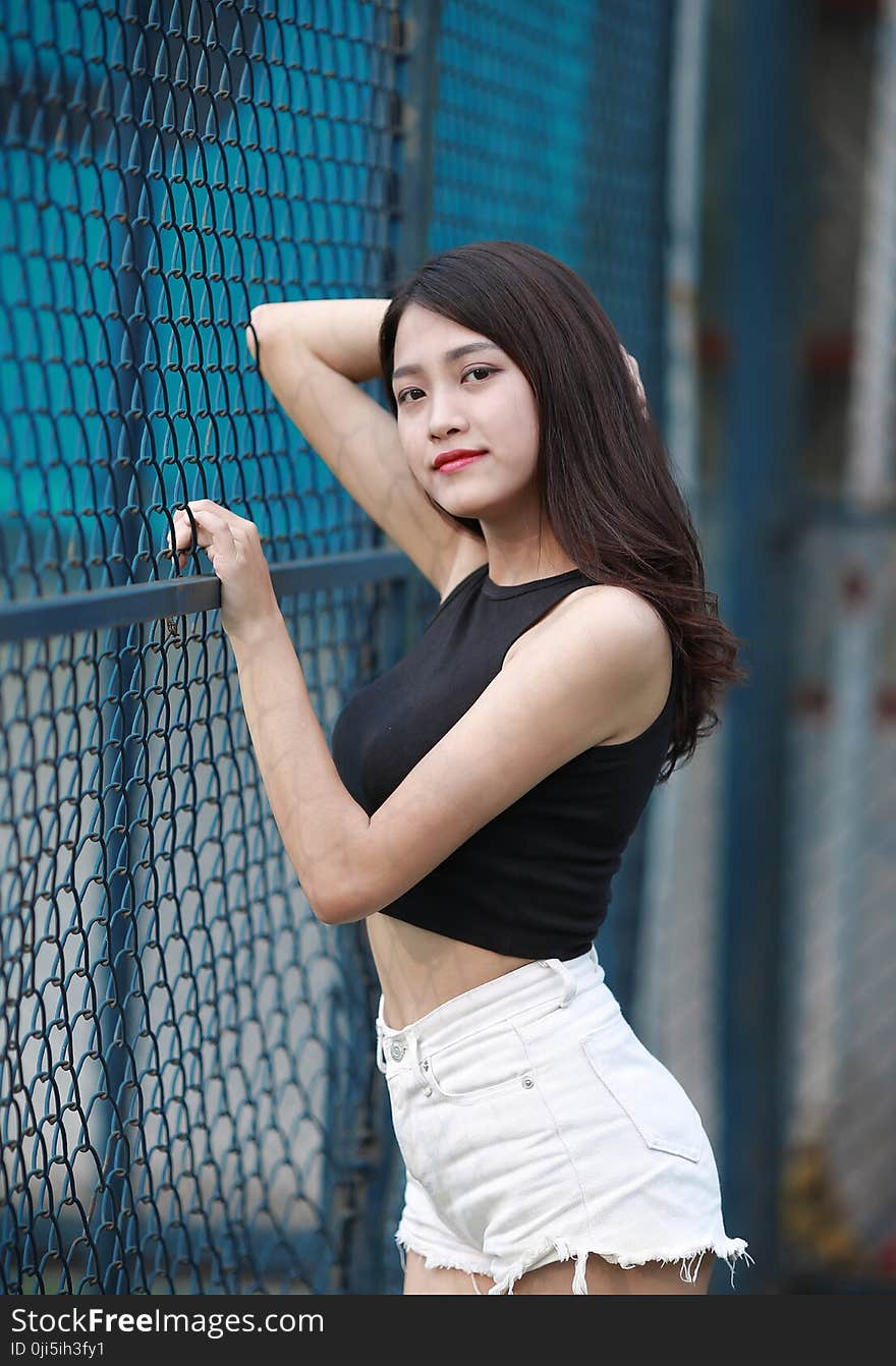 Woman Wearing Back Crop Top and White Short Shorts