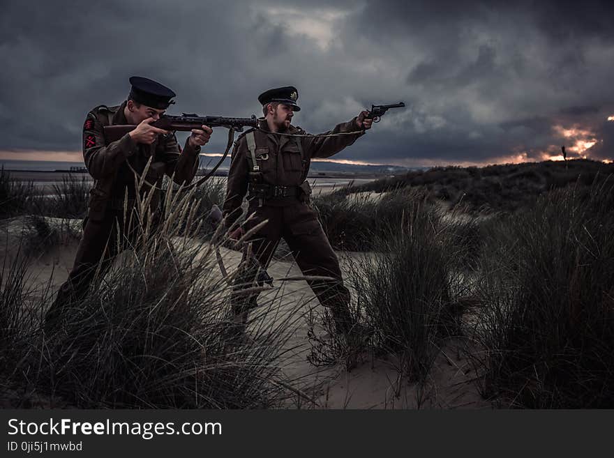 Two Man Holding Rifle and Pistol Illustration