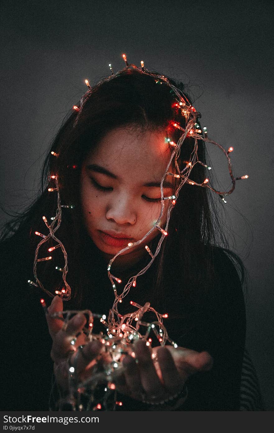 Woman Wears Black Long-sleeved Shirt Hold String Lights