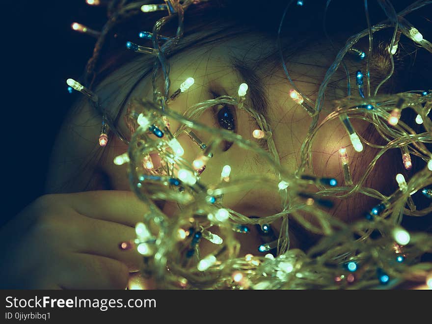 Girl Facing Turned on String Light