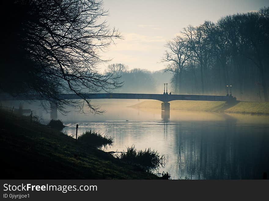 Gray Bridge Above River during Dusk