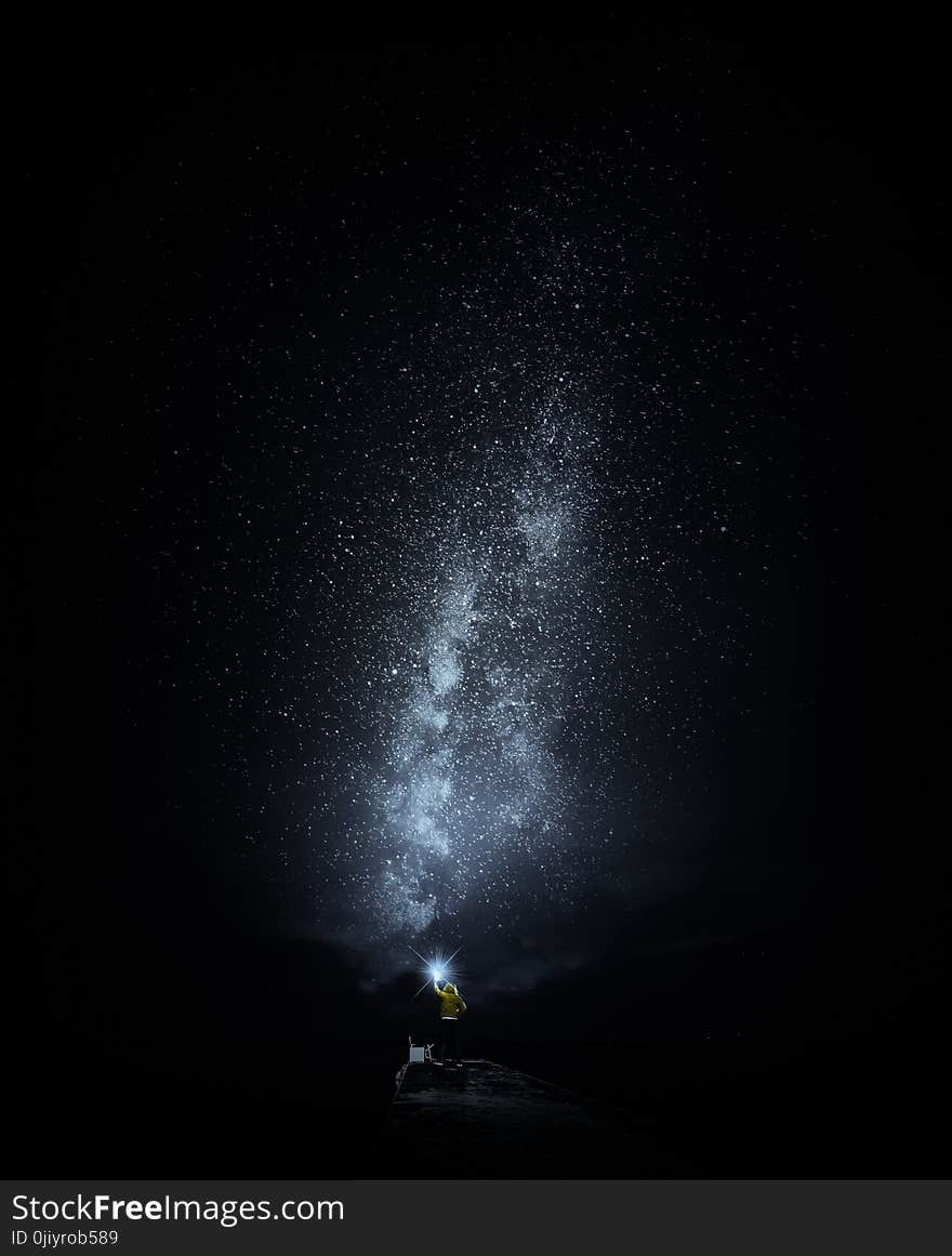 Person Standing Under Starry Night