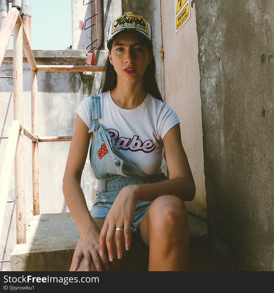 Siting Woman Wearing White Shirt