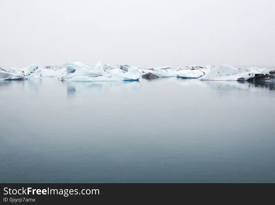 Landscape Photography of Body of Water Near Ice Berg