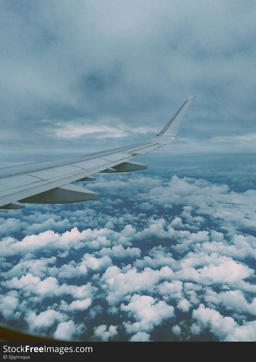 Airplane Wing and Thick Clouds