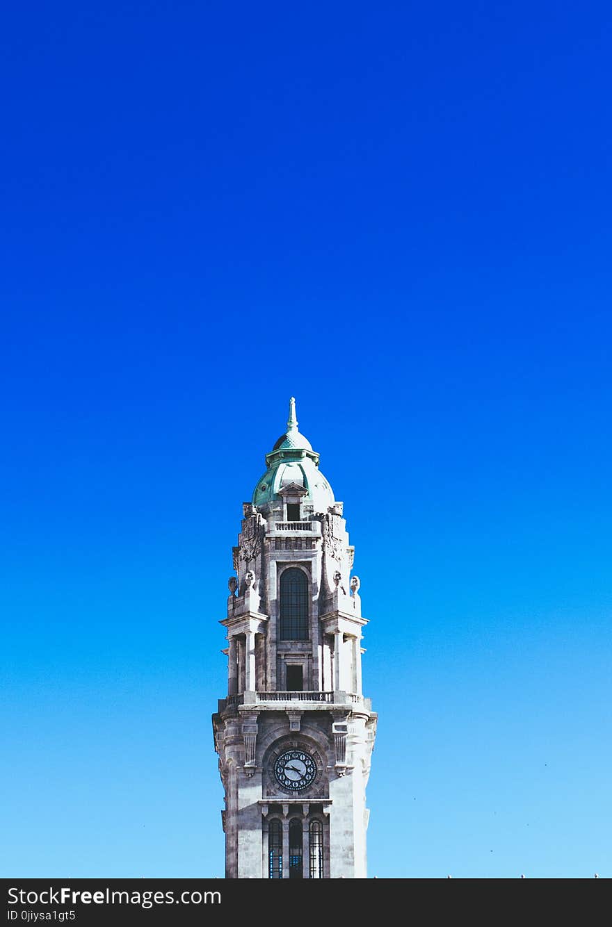 Gray Concrete Clock Tower Under Blue Sky