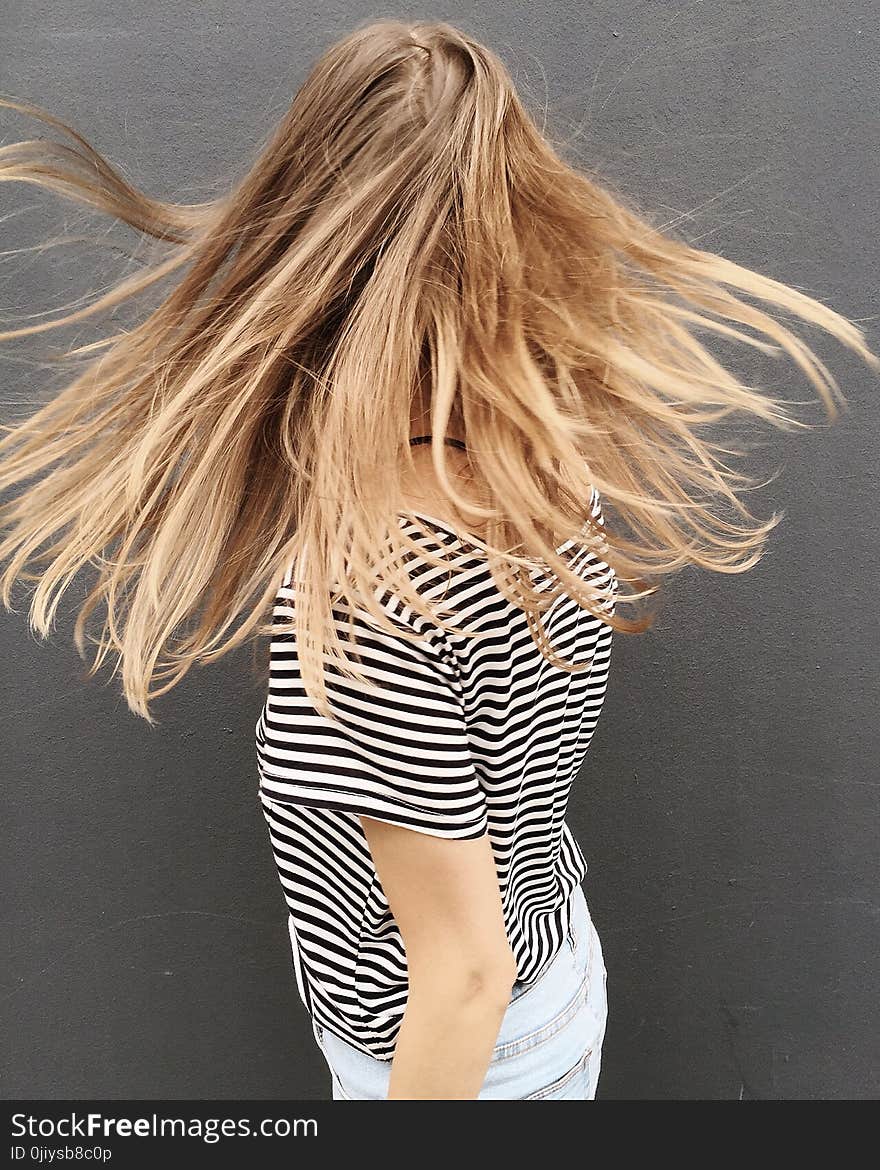 Woman Wearing Black and White Stripe Blouse