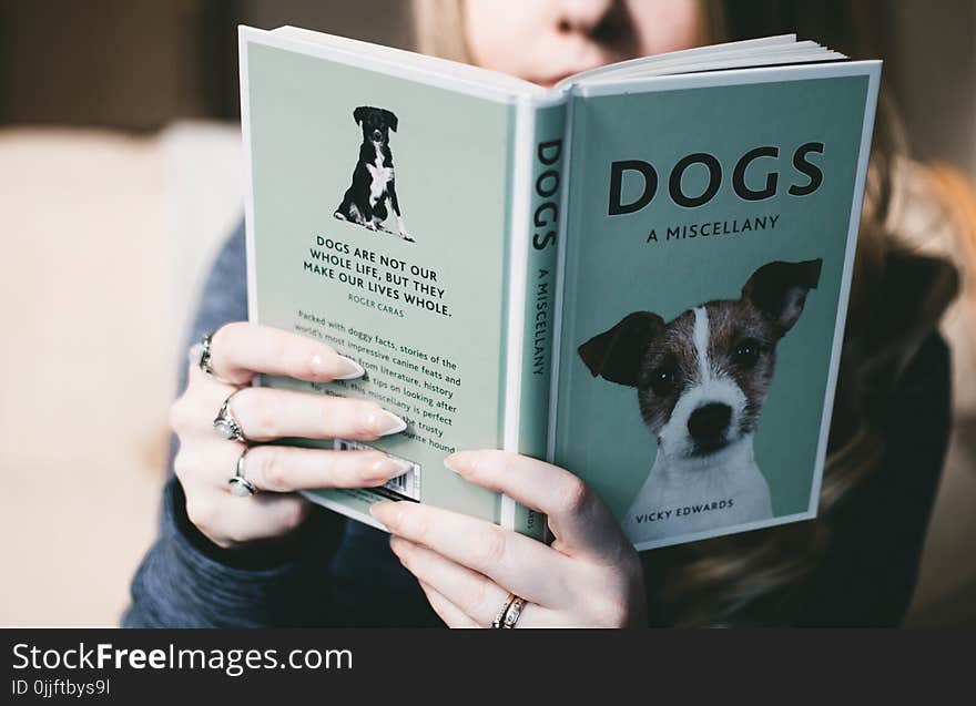 Woman Holding Dogs a Miscellany Book