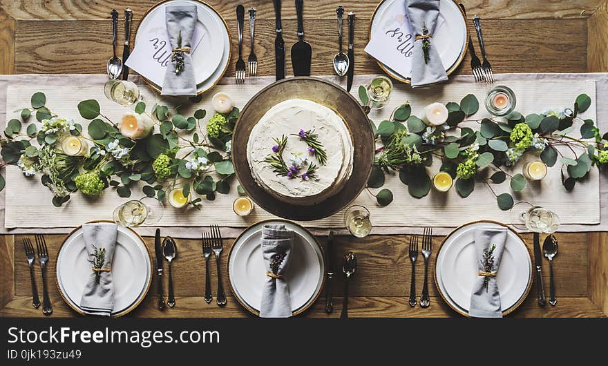 Photo of White Dinnerware Plate Set on Table