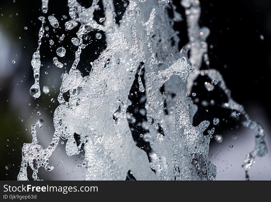 The gush of water of a fountain. Splash of water in the fountain, abstract image