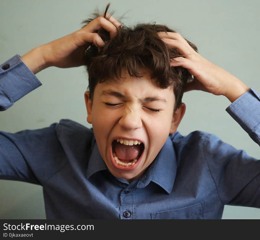 Preteen handsome boy scratch his head itch because of lice invasion