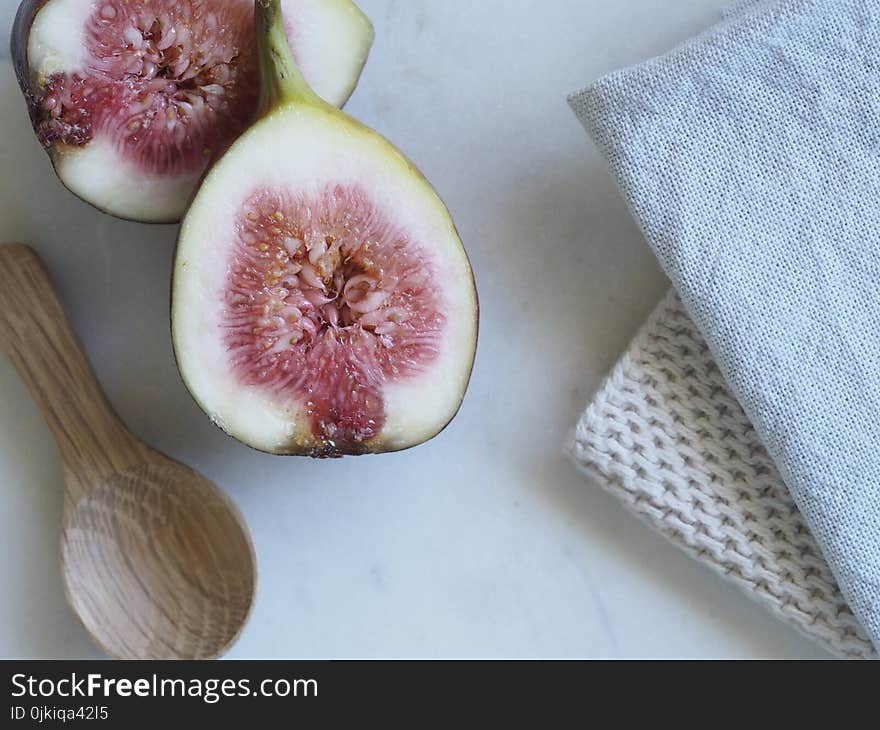 Slice Fruit Beside the Brown Wooden Spatula